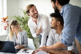 School bursar smiling while reviewing financial reports on a screen.